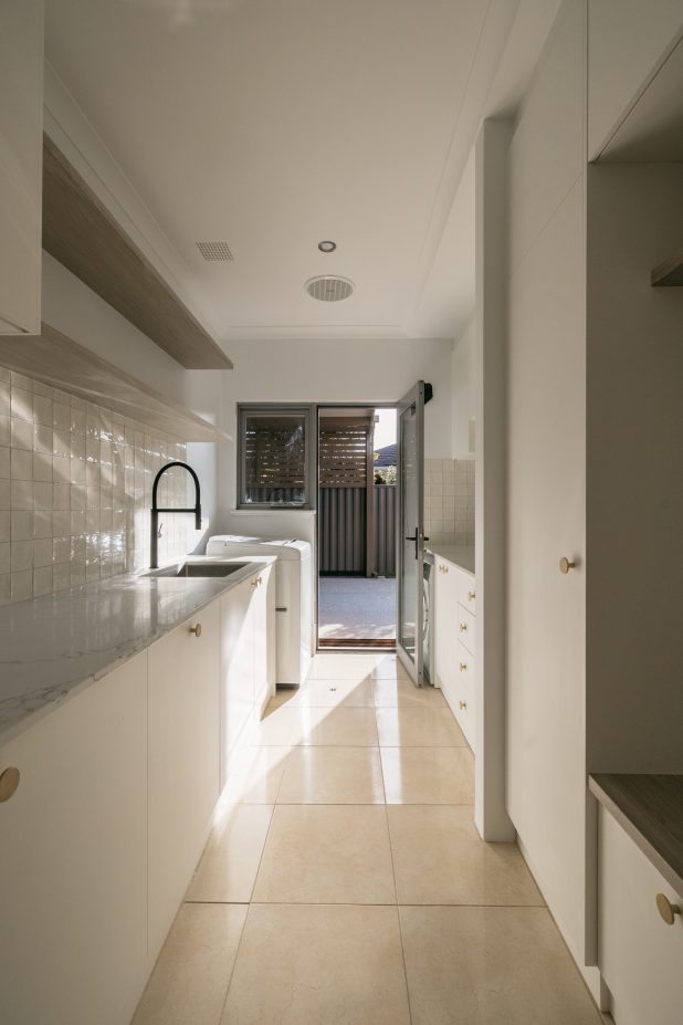black and white small laundry room renovation