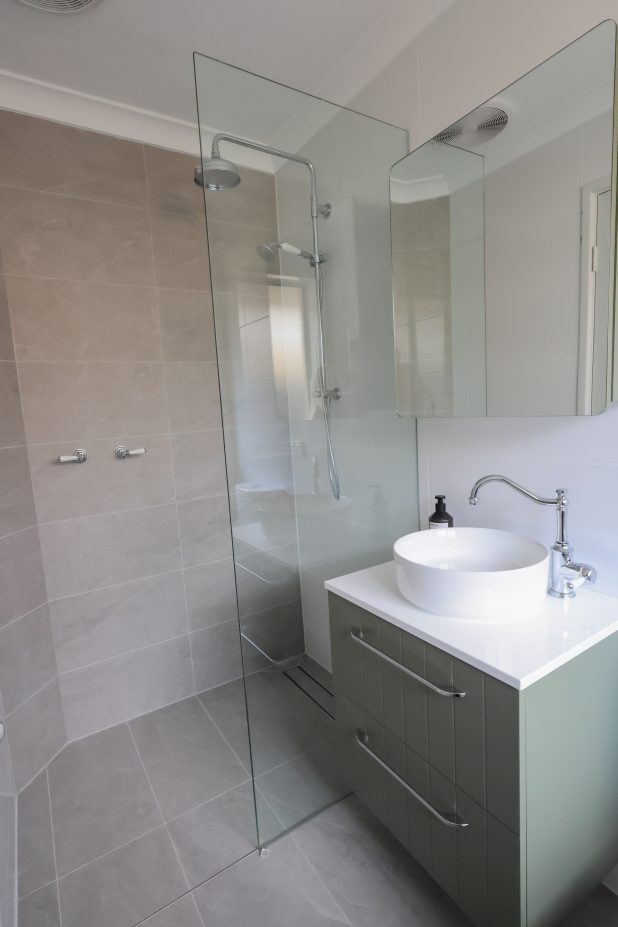 coastal themed bathroom with walk-in shower