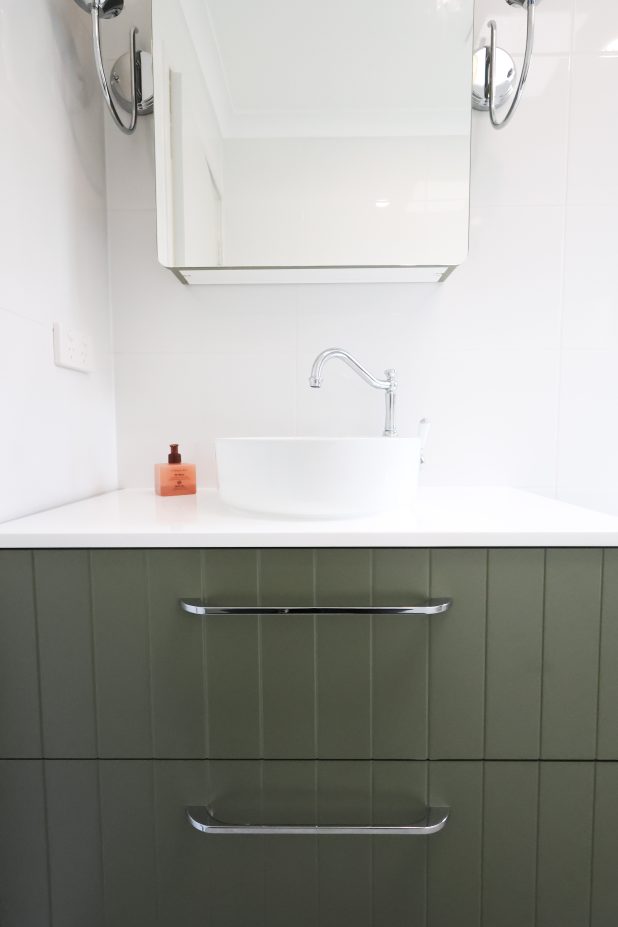 bathroom green vanity with drawers